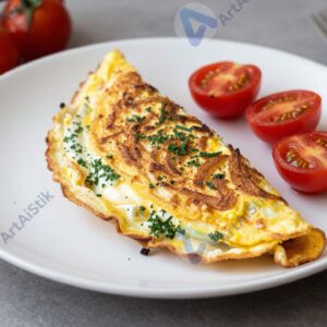 Омлет с зеленью и помидорами черри на белой тарелке.