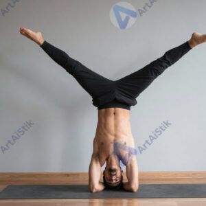 Йог практикует стойку на руках у стены.