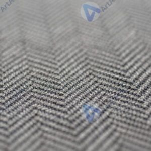 Макро‑фото ткани с узором «ёлочка».