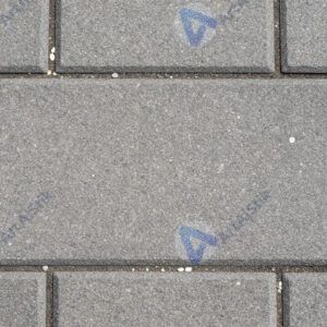 Текстура плит пешеходной дорожки с мелкими камешками.